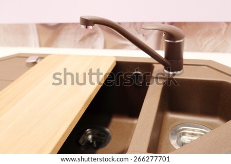 New brown kitchen sink with faucet 