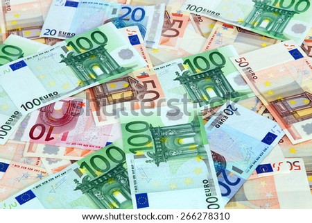 Euro bank notes scattered background