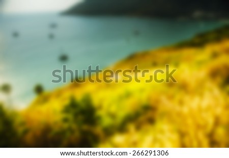 Beautiful blurred tropical view in defocus. Landscape photo with rocks and sea.