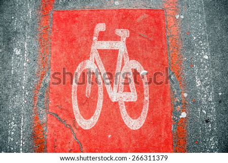 Red Bicycle road sign on the asphalt