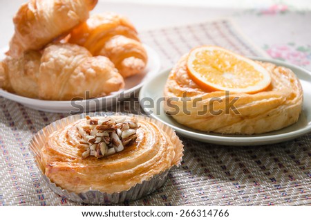 Almond custard danish And orange croissant