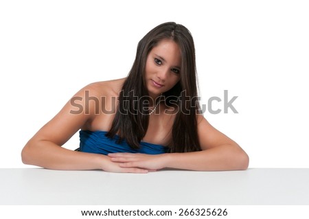 Beautiful young woman sitting in a chair