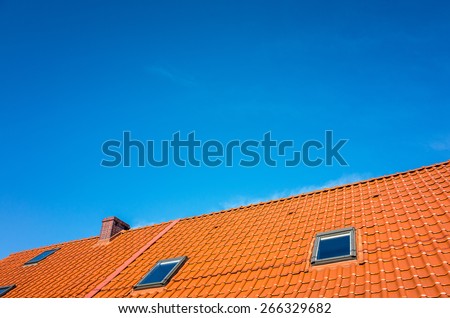 The fragment of the roof with blue sky