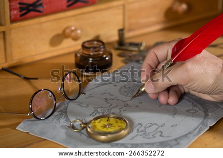 Adventurer drawing a map in search of a lost treasure