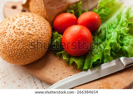 Hamburger ingredients on wood table