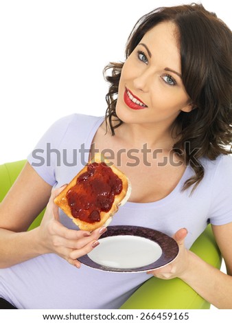 Healthy Young Woman With Strawberry Jam on Toast