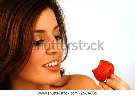 pretty girl eating strawberry