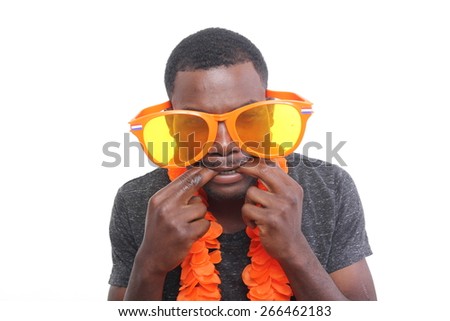 Beautiful young man with orange stuff