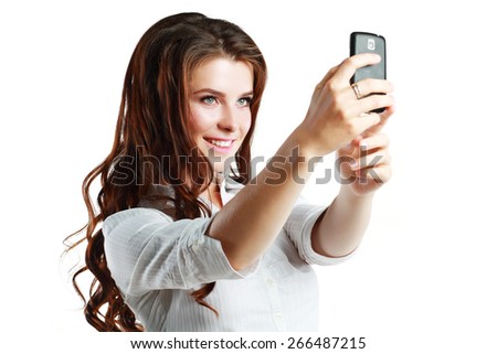 Beautiful woman taking self picture with smartphone camera