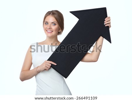 Beautiful young business woman holding black arrows, over a white background