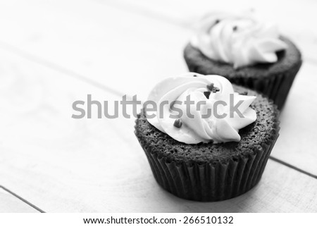 Red velvet cupcake closeup. Filtered to look like an aged instant photo, black and white photo