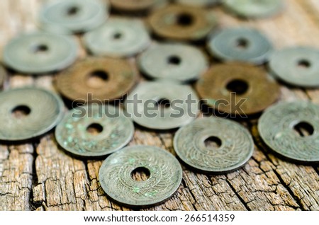 antique coins on wooden background