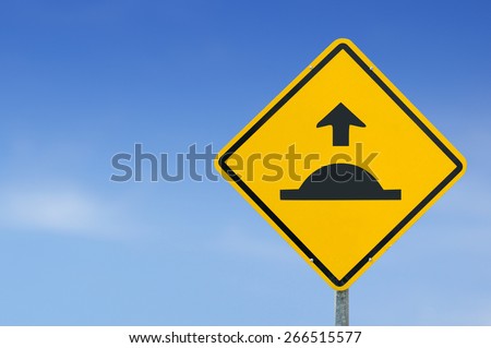 caution speed hump icon yellow road sign on sky background