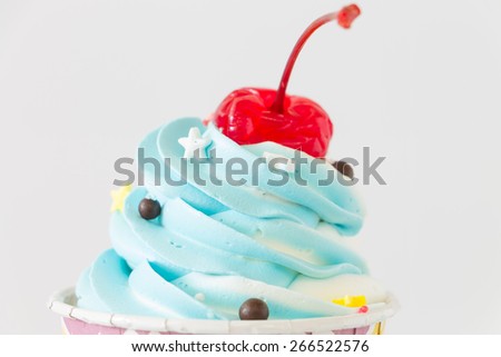 Colorful Cupcakes with icing and chocolate on white background
