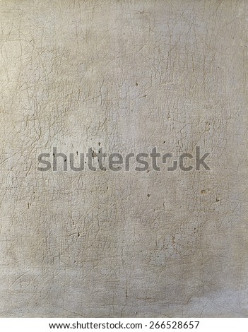 Image of an old, grungy piece of canvas with crevice and stain After dyeing anointed knife to scrape off dirt with a paint  on the campus clearance wounds. 