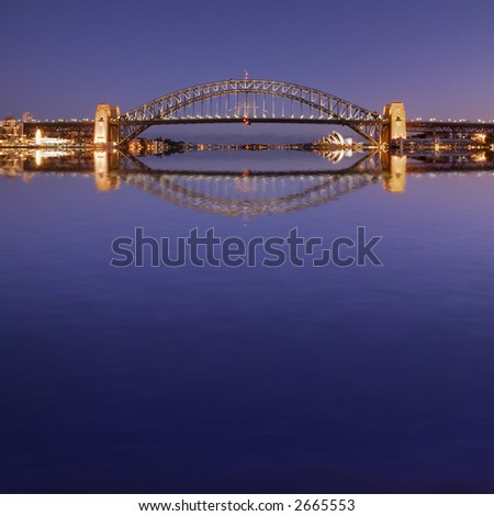 Fun picture of Sydney Harbour Bridge and Opera House, with a deep purple twilight sky and a Photoshop reflection in the harbour.