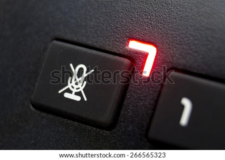 Mute button on telephone close up Royalty-Free Stock Photo #266565323