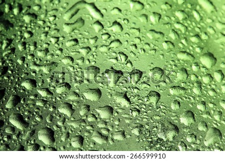macro texture water drops on green glass studio