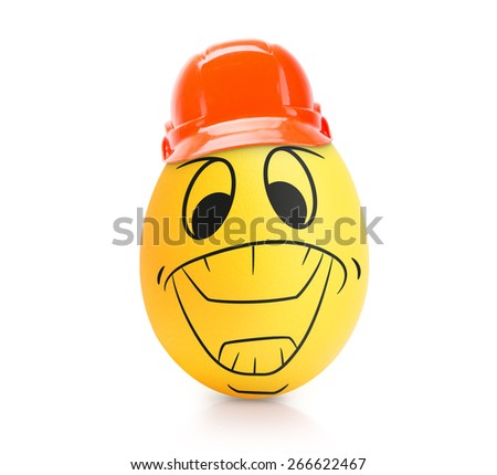 Yellow cute egg with emotional face in construction helmet isolated