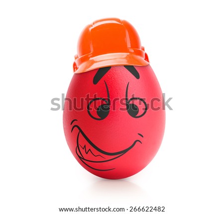 Red evil egg with emotional face in construction helmet isolated