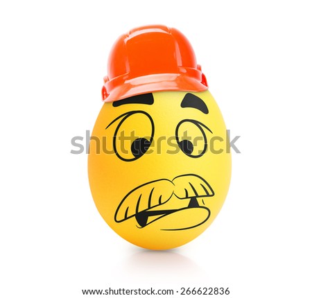 Yellow intelligent te egg with emotional face in construction helmet isolated