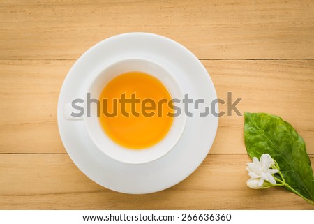 Cup of tea on a wooden background top view Royalty-Free Stock Photo #266636360