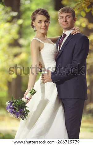wedding photo, bride and groom embracing at wedding, European style
