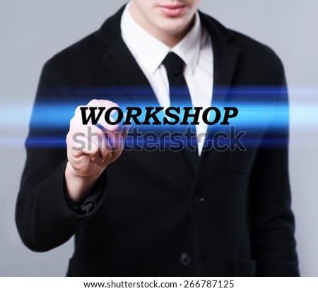 business, technology and internet concept - businessman is writing workshop text