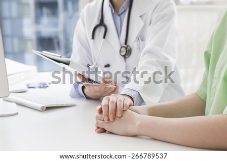 Doctor explaining diagnosis to her female patient Royalty-Free Stock Photo #266789537