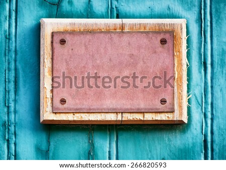 old blank sign at a door