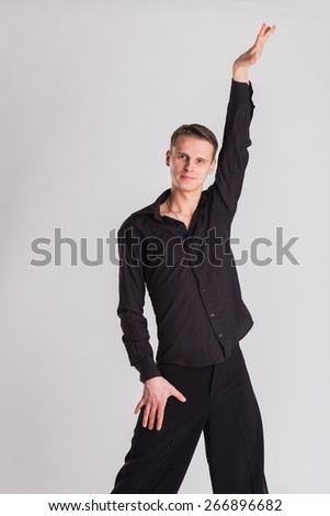 Man Dancer ballroom dancing. Portrait of a dancer on a light background. Sports, dancing, active, healthy lifestyle.