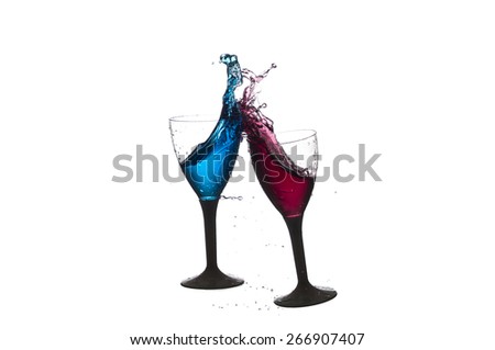 Wine glass cup crashing with red and blue liquid