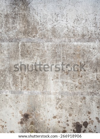 Old gray cracked concrete wall with stripes, scratches and mold