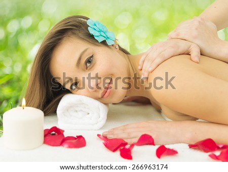 asian woman enjoying a massage in the spa. concept about massages, wellness, body care and people