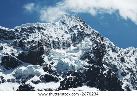 Snowcowered high cordillera mountain and clouds