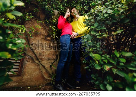 loving couple in the garden of the Vatican Museum in Rome Italy among bushes