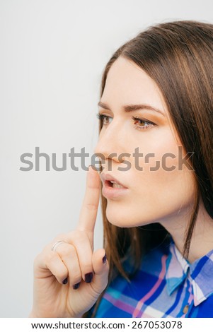 profile woman with silence hush sign gesture saying hush be quiet copy space isolated on white background