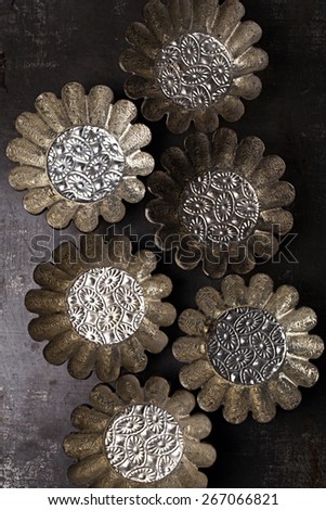 abstract picture with Vintage Baking Tins or molds on dark metal background