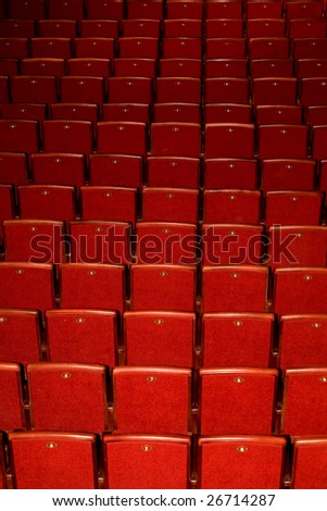 Stock photo: an image of rows of red chairs
