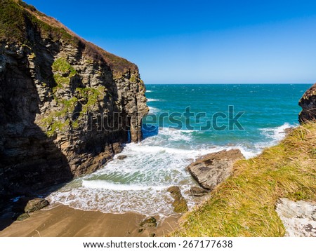 Overlooking the sandy beach at Bossiney Cove Tintagel Cornwall England UK Europe
