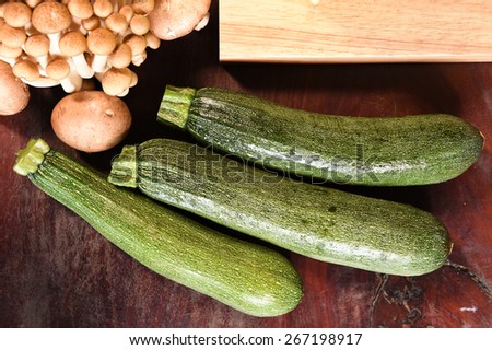 Fresh vegetables and ingredients for pizza on the wooden background