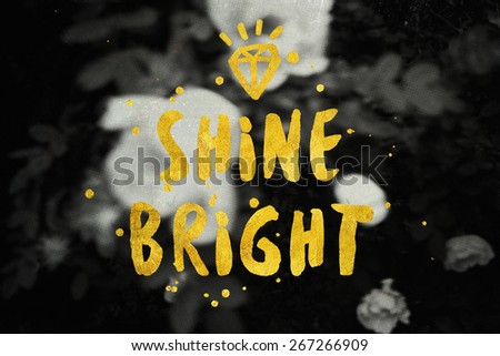 Shine Bright typography poster in black and gold colors. Beauty fashion background. Inspirational quotes.