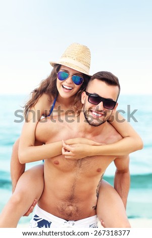 A picture of a happy couple having fun at the beach