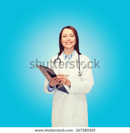 healthcare and medicine concept - smiling female doctor with clipboard and stethoscope