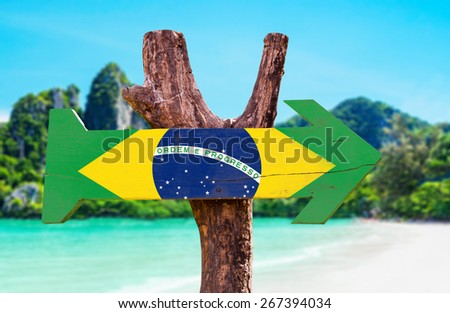 Brazil Flag wooden sign with beach background