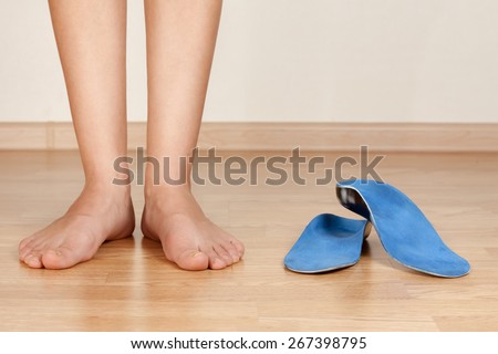 the girl's legs and orthotics Royalty-Free Stock Photo #267398795