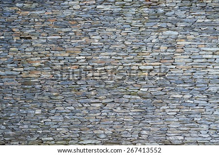 The surface of the stone wall background Royalty-Free Stock Photo #267413552
