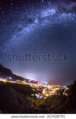 Milky Way. Beautiful summer night sky with stars, sea and rocks. Crimea mountains