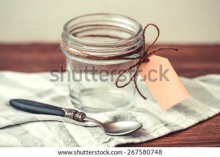 Empty jar with paper label. Blank label provides copy space for a message. Toned picture