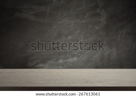 black desk top and black blackboard 